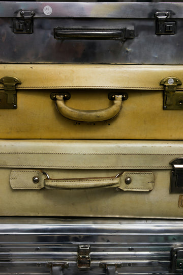 Stacked travel suitcases representing useful travel gadgets