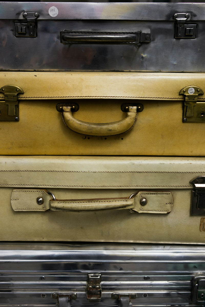 Stacked travel suitcases representing useful travel gadgets