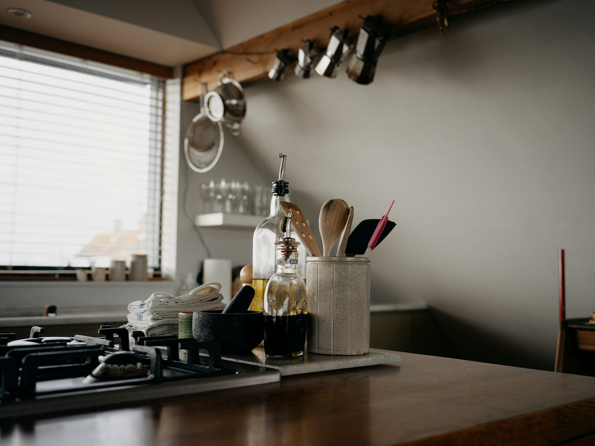 Kitchen counter with cooking tools and bottles