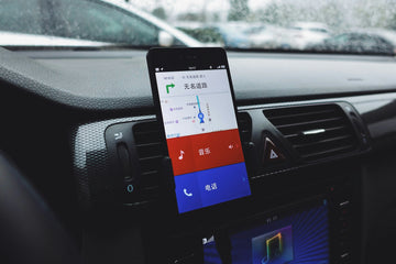 Smartphone mounted on a car dashboard for navigation