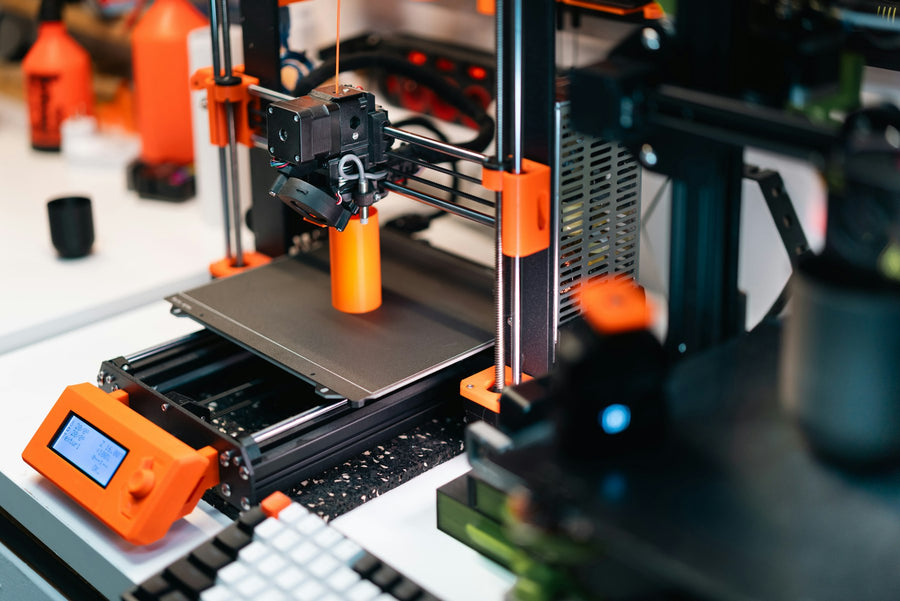 3D printer creating a colourful model in a workshop